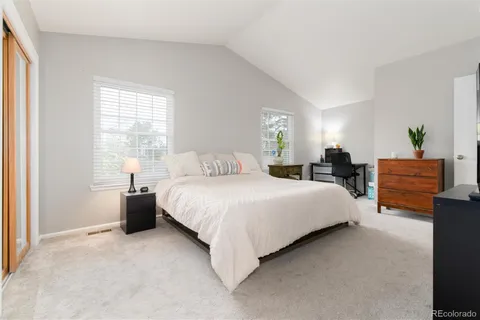 a view of a backyard with a chair and a tree