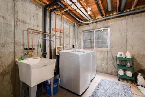 a view of a patio with table and chairs and potted plants