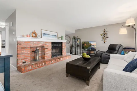 a kitchen with stainless steel appliances granite countertop a refrigerator stove microwave and sink