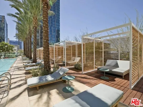 a building outdoor space with patio furniture and garden
