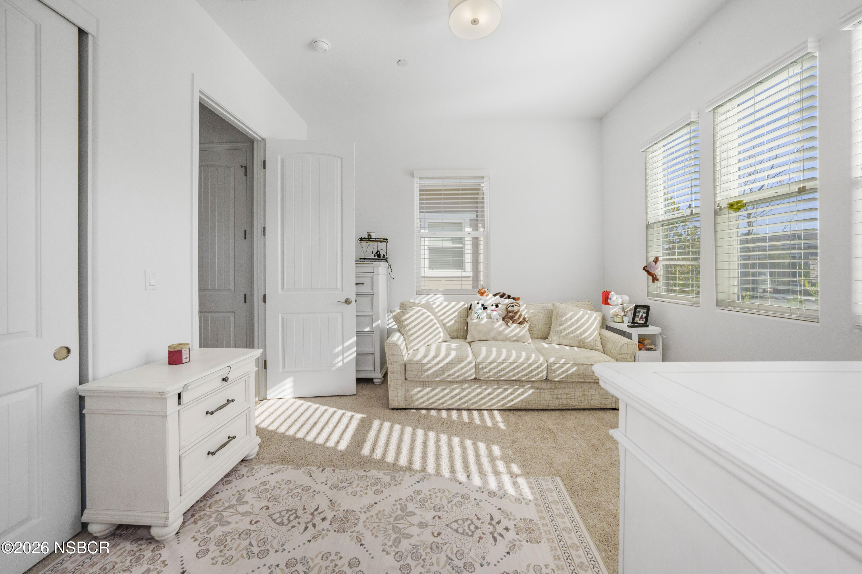 751 Skyview Lane Santa Maria, CA 93455 - Photo 16 of 31 a spacious bedroom with a bed and a couch