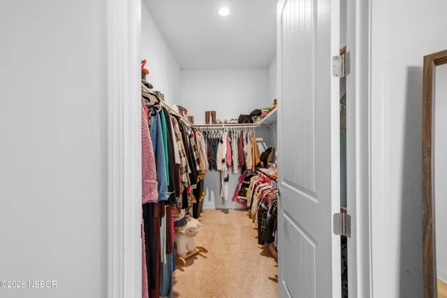 a view of a closet with storage