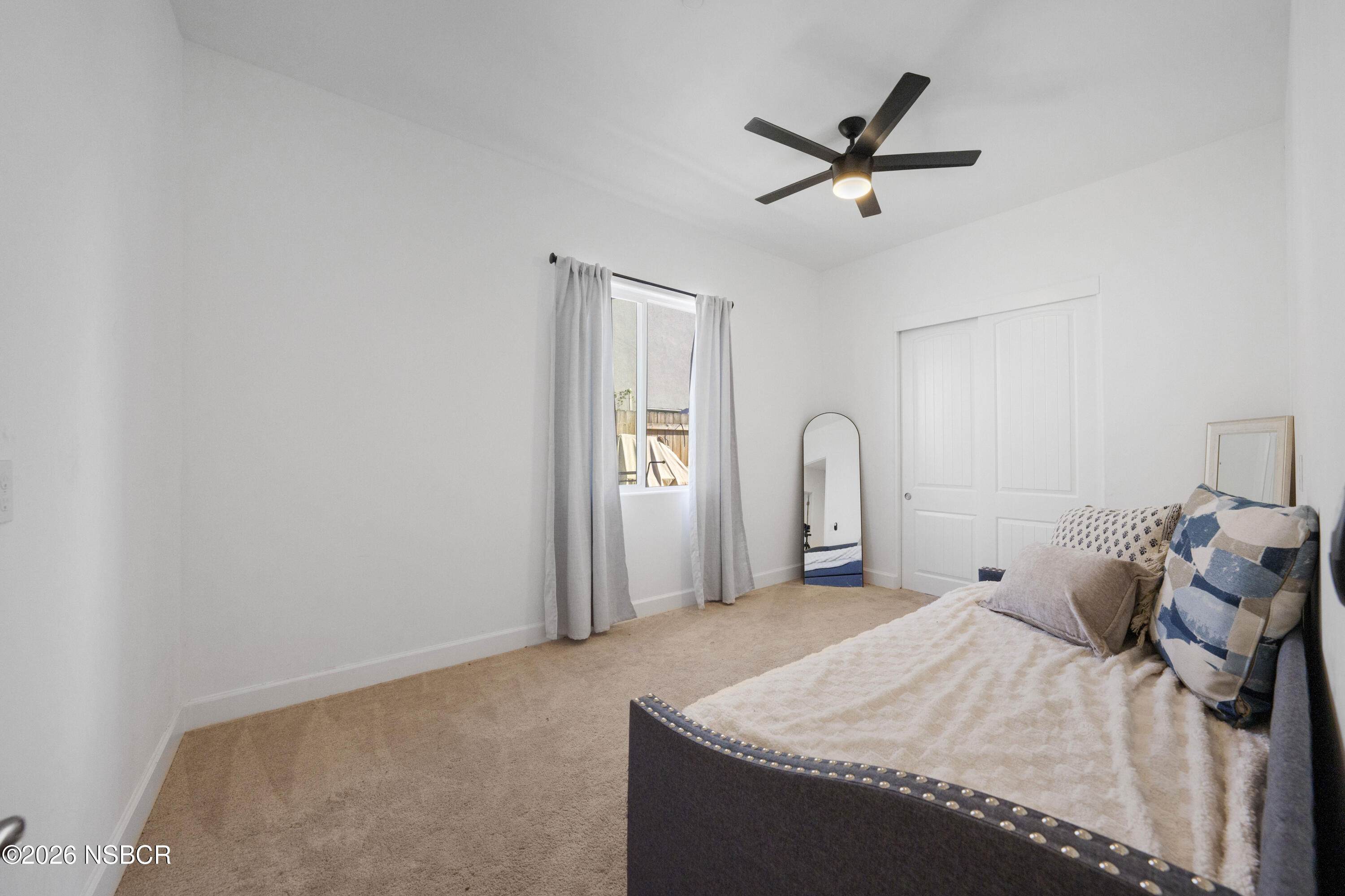 751 Skyview Lane Santa Maria, CA 93455 - Photo 28 of 31 a bedroom with a bed and a ceiling fan
