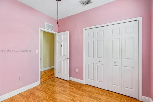 a view of livingroom with hardwood floor and a ceiling fan