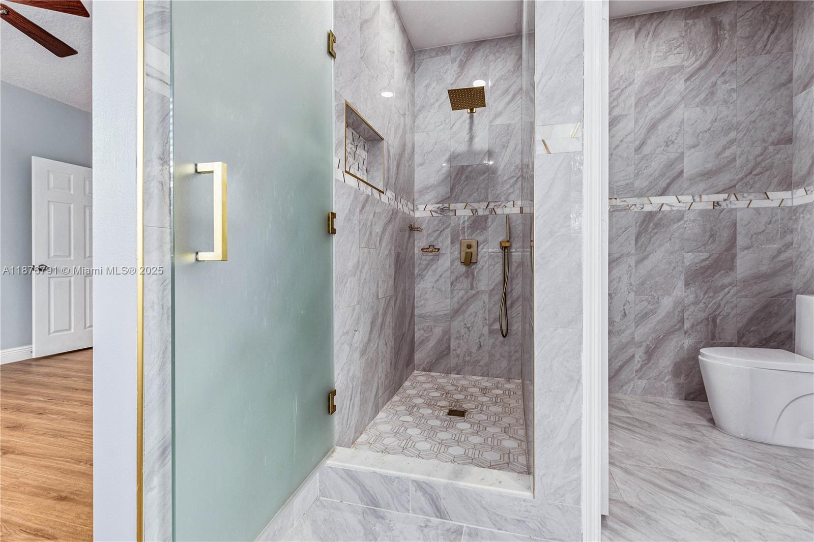 20235 Southwest 129th Avenue, Unit 20235 Miami, FL 33177 - Photo 26 of 35 a bathroom with a granite countertop shower