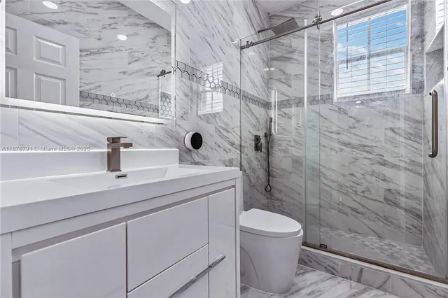 a front view of a house with a large windows