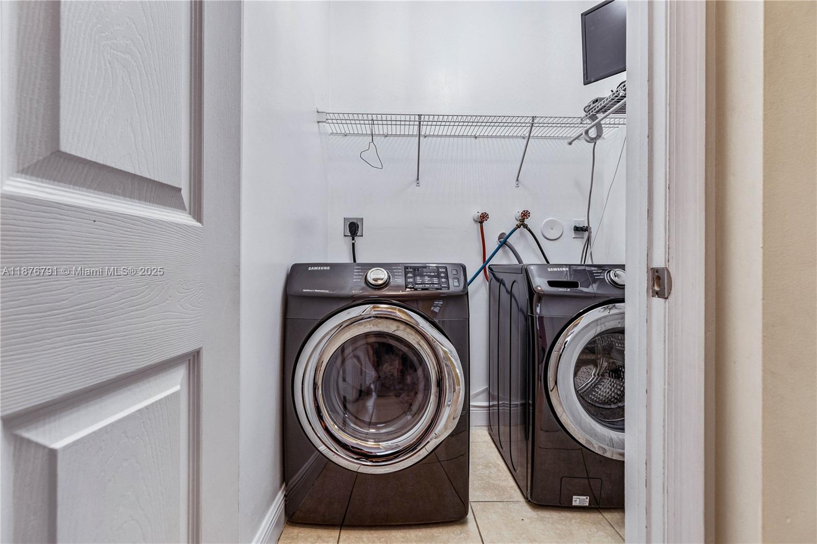 20235 Southwest 129th Avenue, Unit 20235 Miami, FL 33177 - Photo 30 of 35 a utility room with dryer and washer