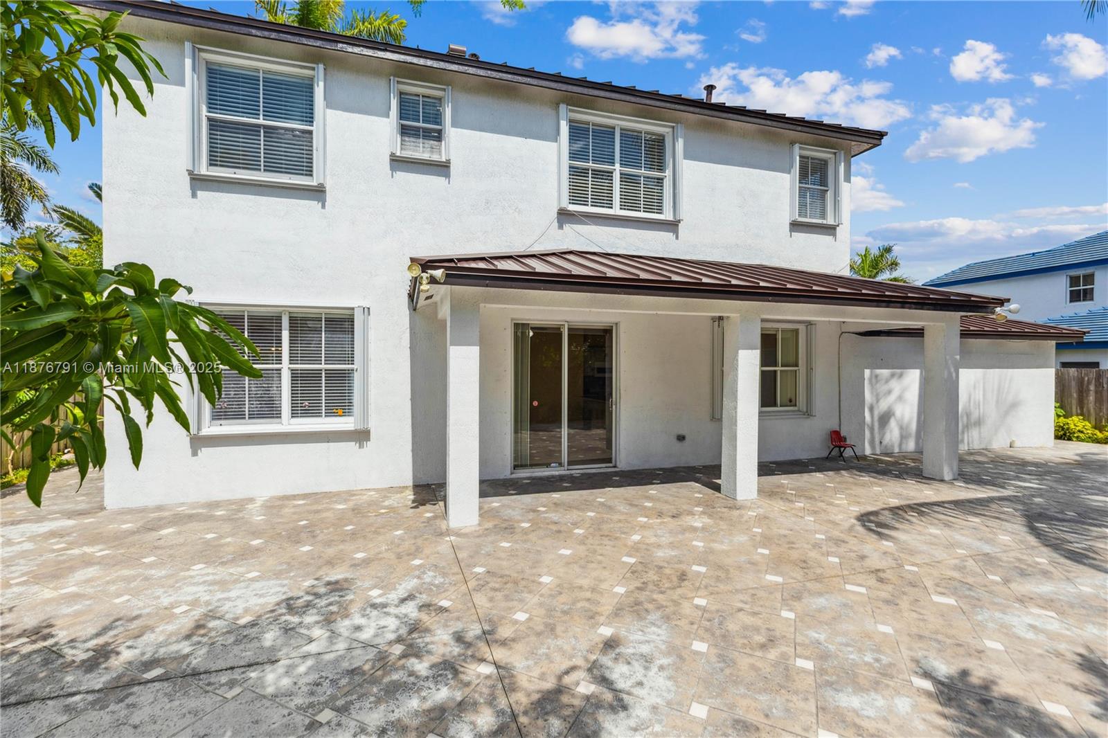 20235 Southwest 129th Avenue, Unit 20235 Miami, FL 33177 - Photo 31 of 35 a front view of a house with a large windows
