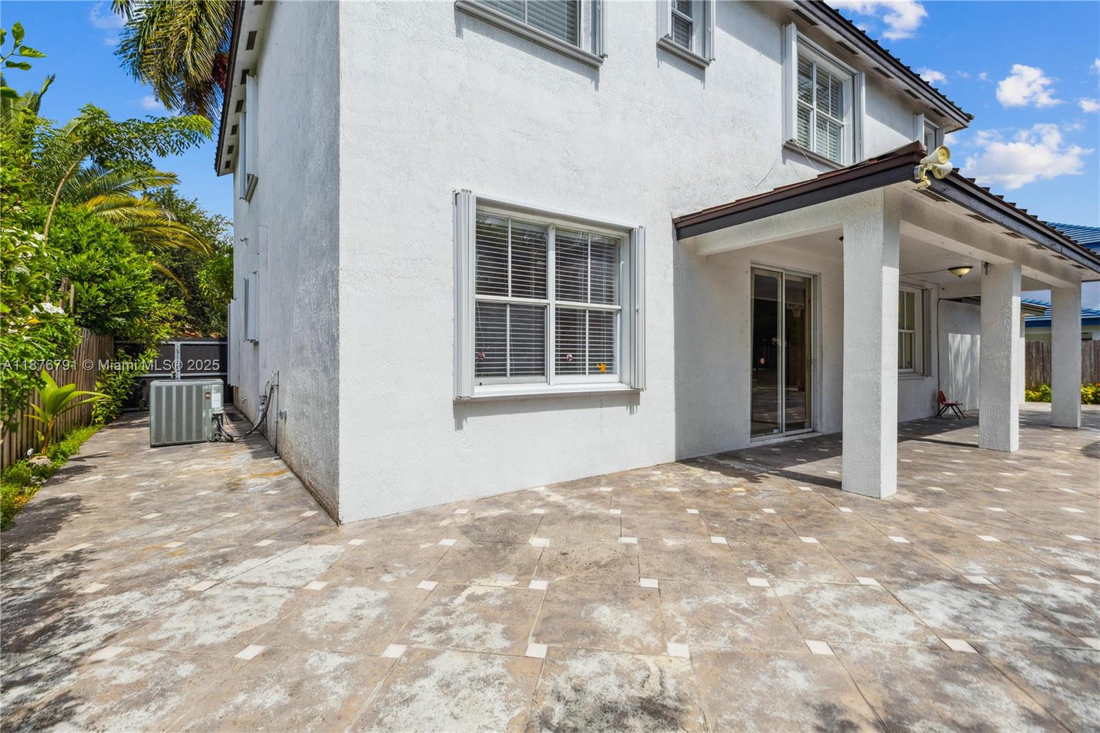 20235 Southwest 129th Avenue, Unit 20235 Miami, FL 33177 - Photo 34 of 35 a view of a house with a yard
