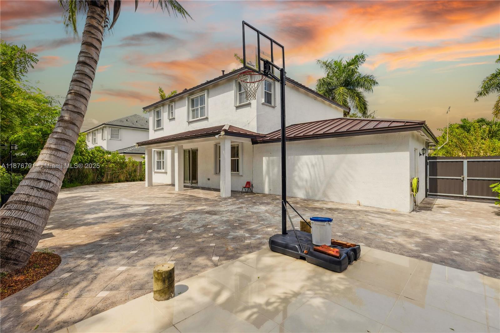 20235 Southwest 129th Avenue, Unit 20235 Miami, FL 33177 - Photo 35 of 35 a front view of a house with a yard and garage