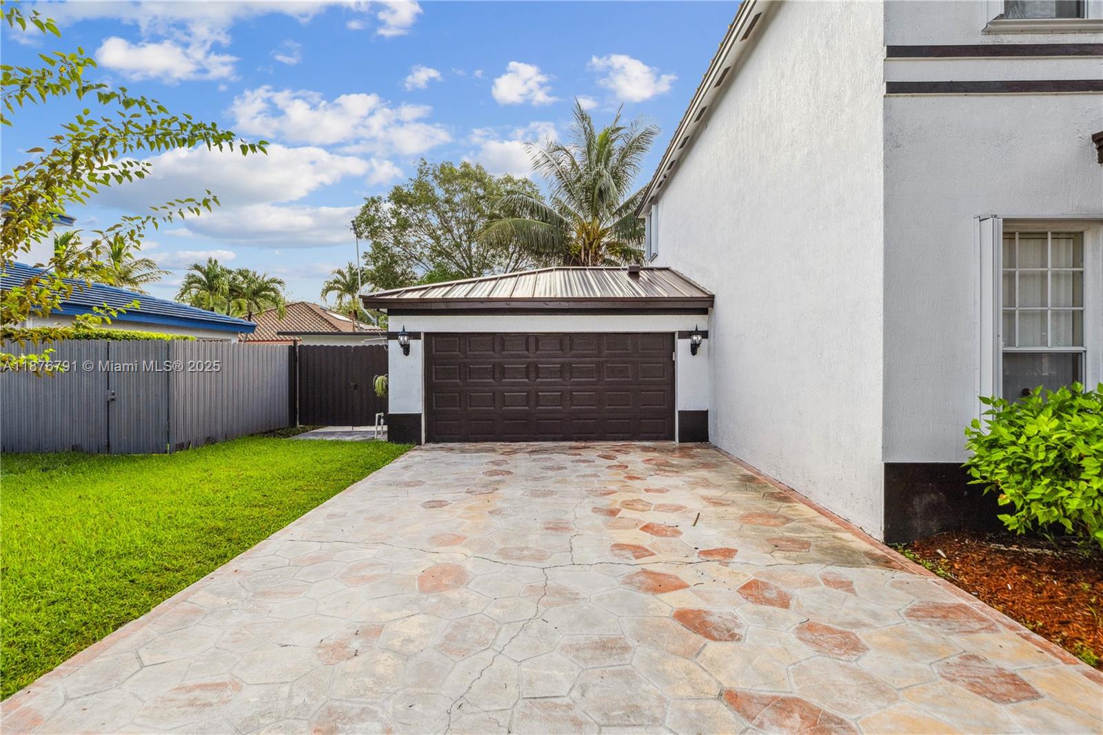 20235 Southwest 129th Avenue, Unit 20235 Miami, FL 33177 - Photo 5 of 35 a front view of a house with a yard