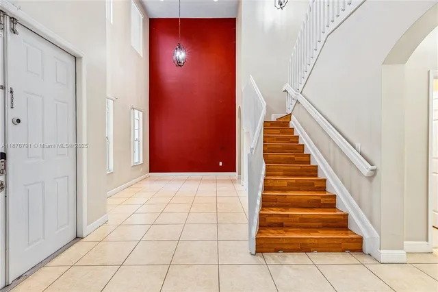 a view of a hallway with entryway door
