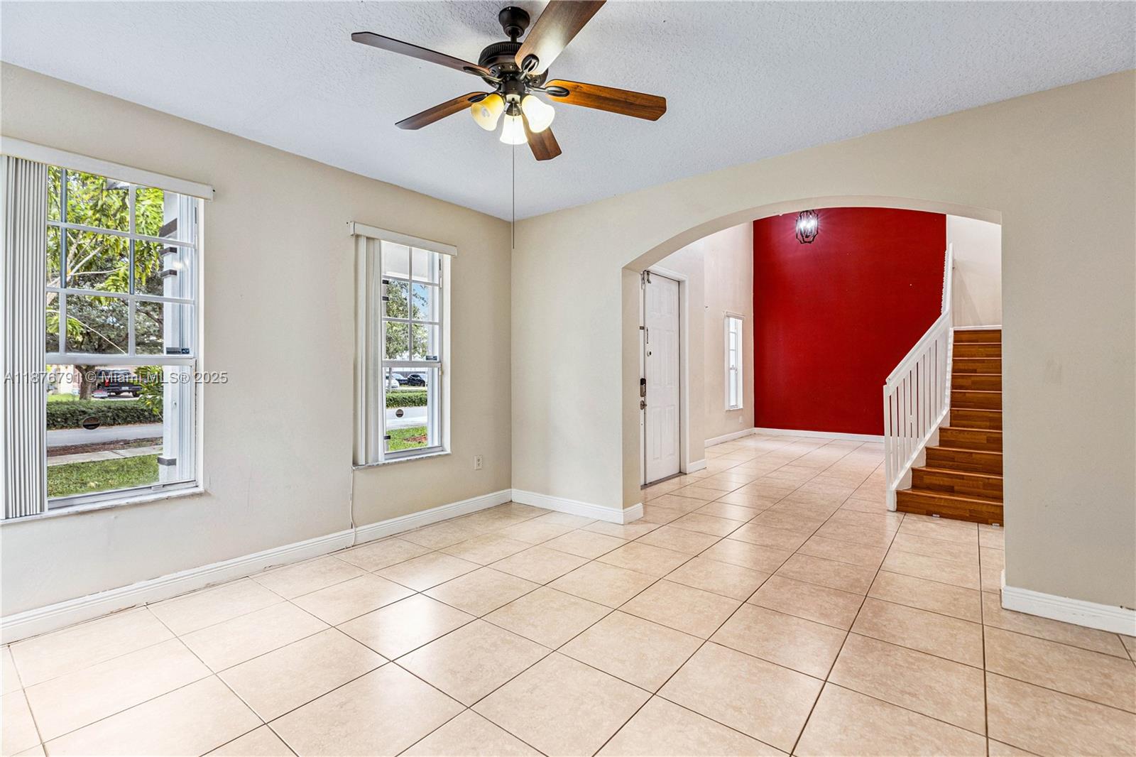 20235 Southwest 129th Avenue, Unit 20235 Miami, FL 33177 - Photo 8 of 35 a view of an empty room with windows