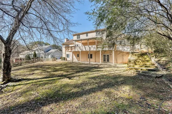 a view of a house with a big yard