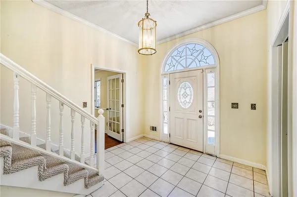 a view of an entryway with wooden floor