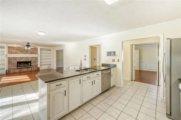 a large bathroom with a double vanity sink a large mirror and a shower