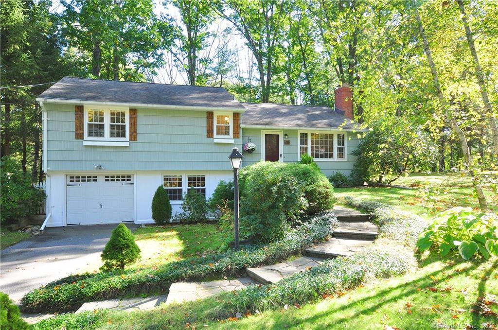 28 Freedom Drive Canton, CT 06019 - Photo 1 of 1 a view of a house with backyard and sitting area