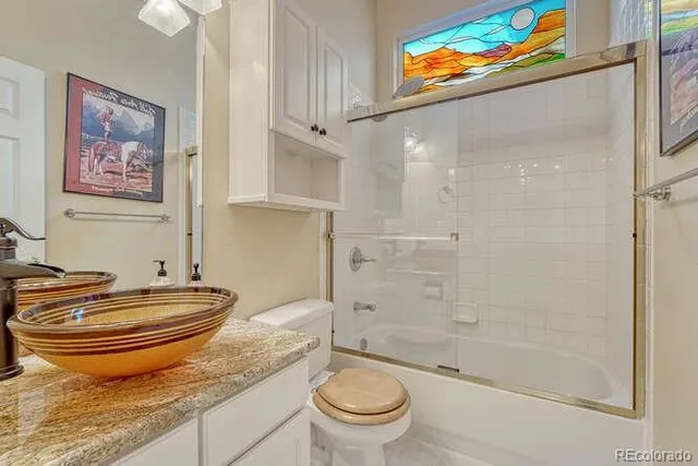 a view of a bedroom with furniture and closet
