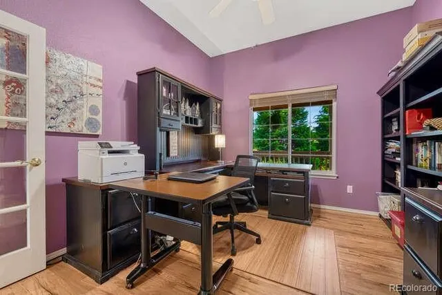a room with furniture pool table and wooden floor