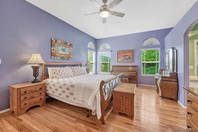 a bedroom with a bed a dresser and dresser