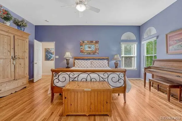 a bedroom with a bed and a table in it