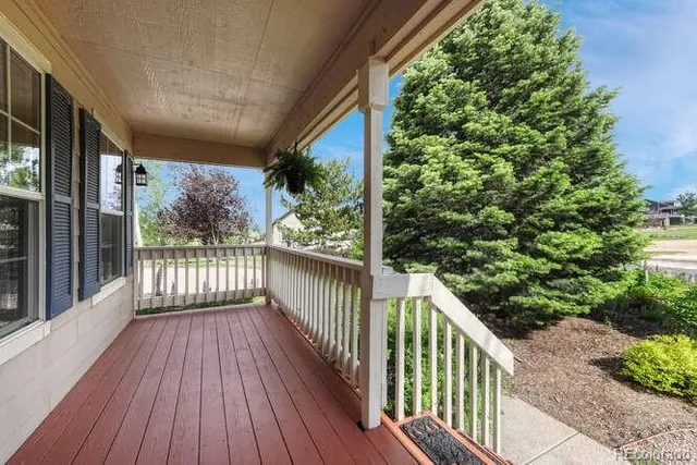 a view of a balcony with wooden floor