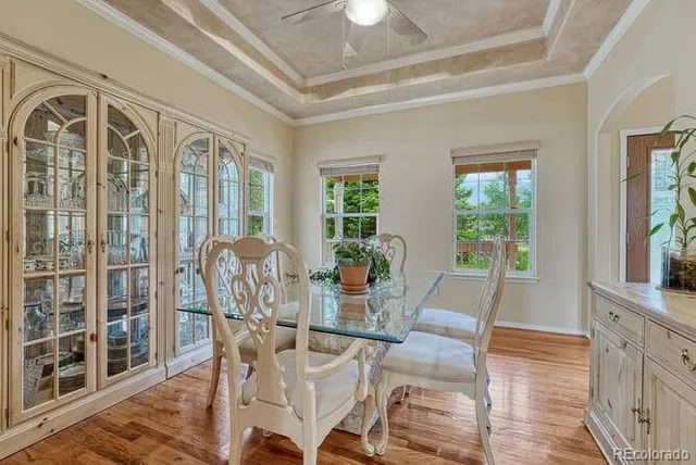 a view of a dining room with furniture and wooden floor