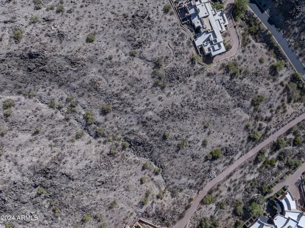 an aerial view of residential house and green space
