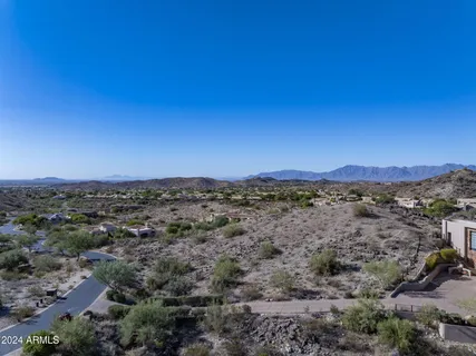a view of roof with wooden fence