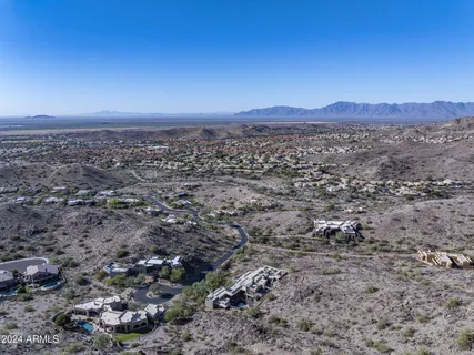 a view of a large mountain with mountains in the background