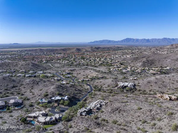 a view of a large mountain with mountains in the background