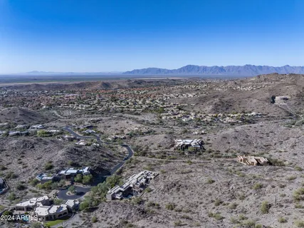 a view of a large mountain with mountains in the background