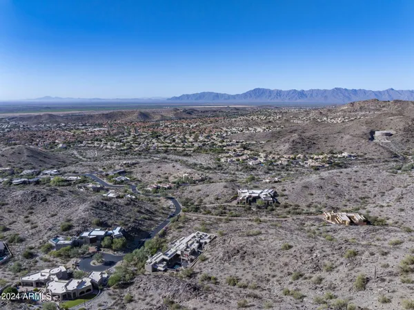 a view of a large mountain with mountains in the background