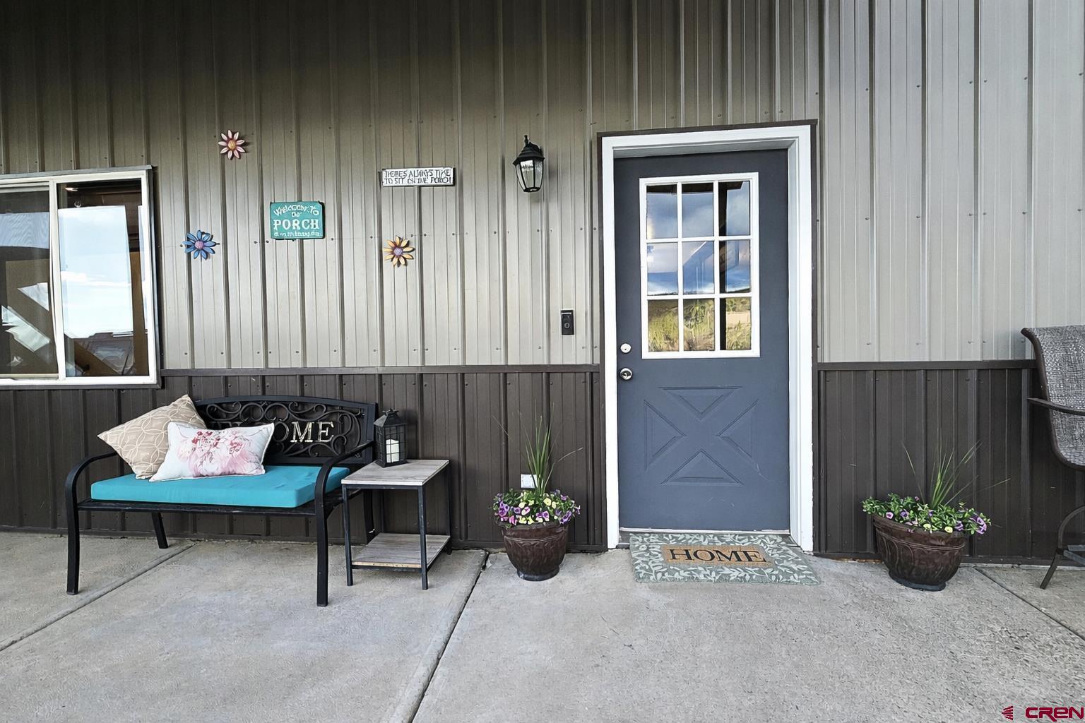 21976 2225th Road Cedaredge, CO 81413 - Photo 29 of 36 a building outdoor space with patio furniture and potted plants