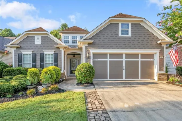 a view of a brick house with potted plants