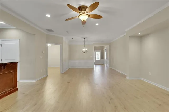 a large bathroom with a large mirror vanity and shower