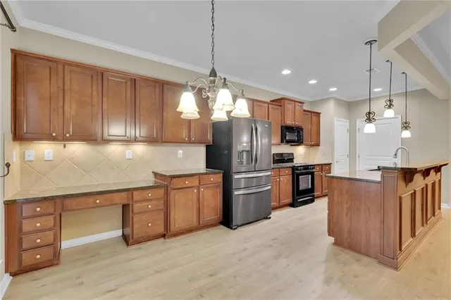 a view of an empty room with window and cabinet
