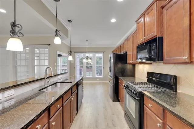 a en suite bathroom with a tub sink and mirror