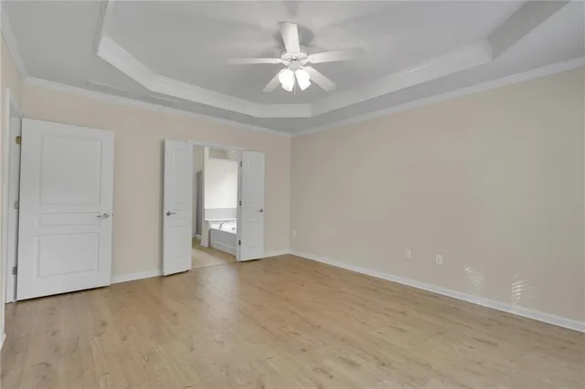 a view of a dining room with furniture and a potted plant