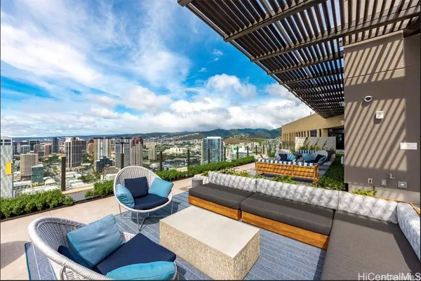 a view of a patio with couches table and chairs and potted plants