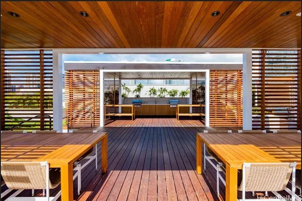 an outdoor space with wooden floor