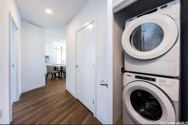 a view of a hallway with washer and dryer