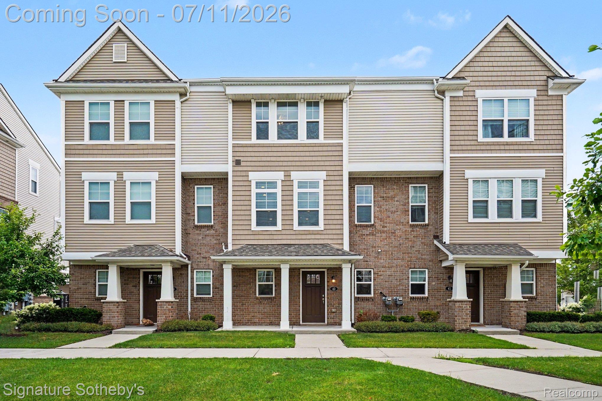2500 Normandy Road, Unit 40 Royal Oak, MI 48073 - Photo 2 of 26 Multi-level townhome featuring a brick and siding facade with gabled roof lines