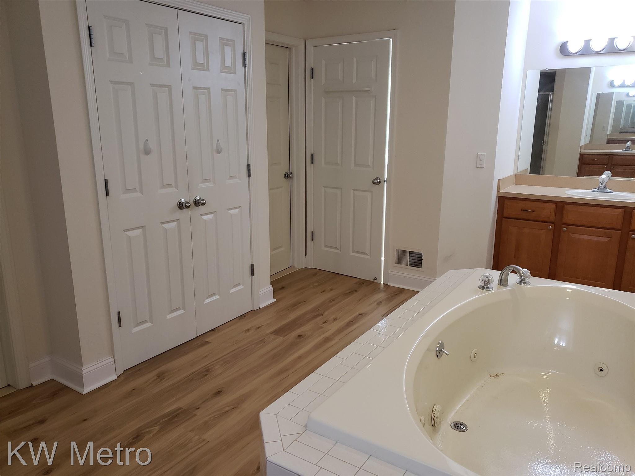 1227 Letica Drive Rochester, MI 48307 - Photo 52 of 58 Primary Bathroom with Linen Closet