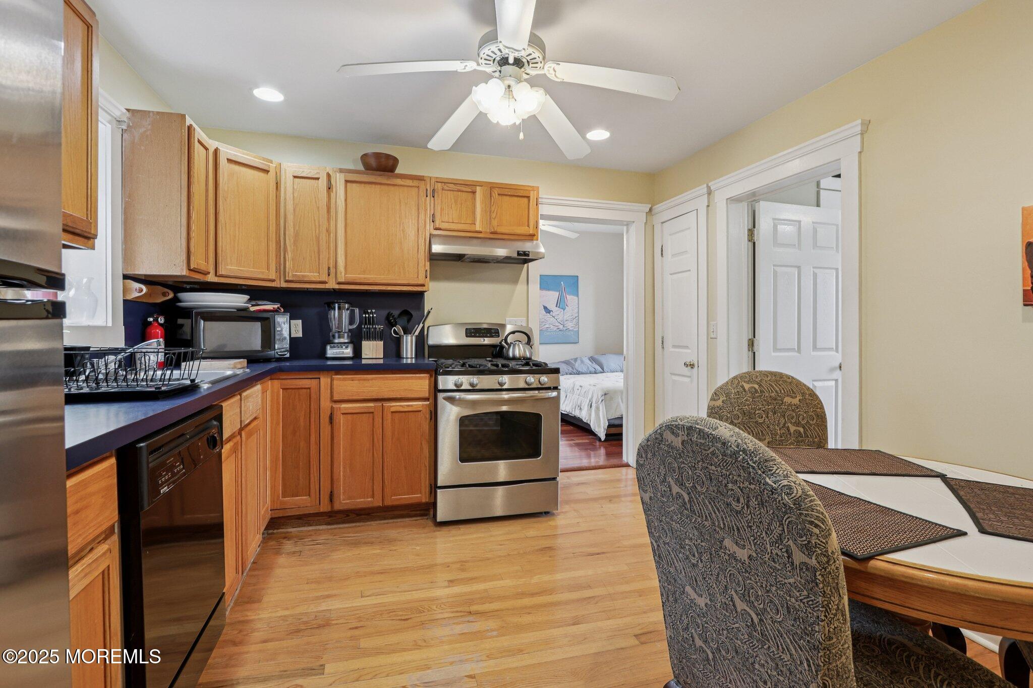 60 Lake Avenue Ocean Grove, NJ 07756 - Photo 14 of 66 a kitchen with a stove a sink and a refrigerator