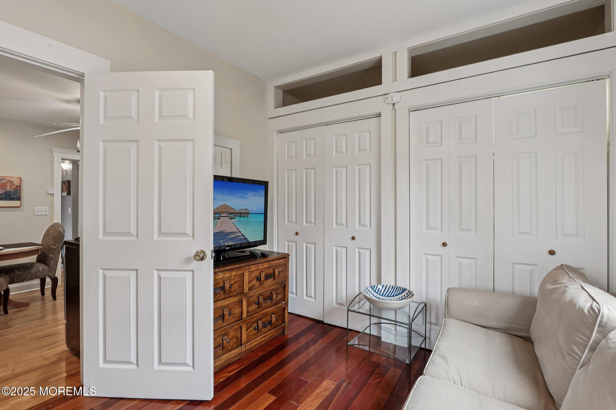 60 Lake Avenue Ocean Grove, NJ 07756 - Photo 18 of 66 a living room with furniture and a flat screen tv