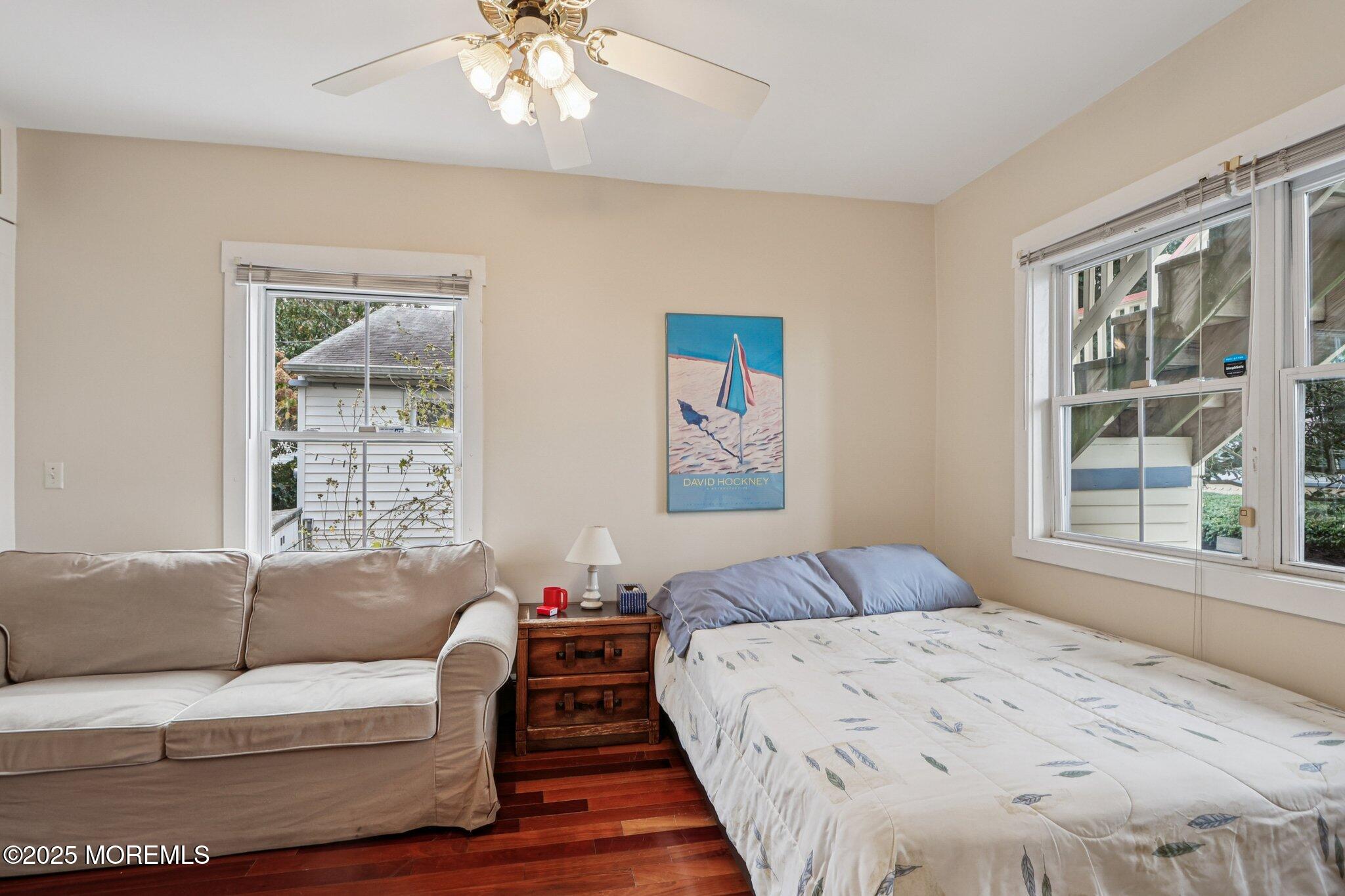 60 Lake Avenue Ocean Grove, NJ 07756 - Photo 19 of 66 a bedroom with a large bed couch and window