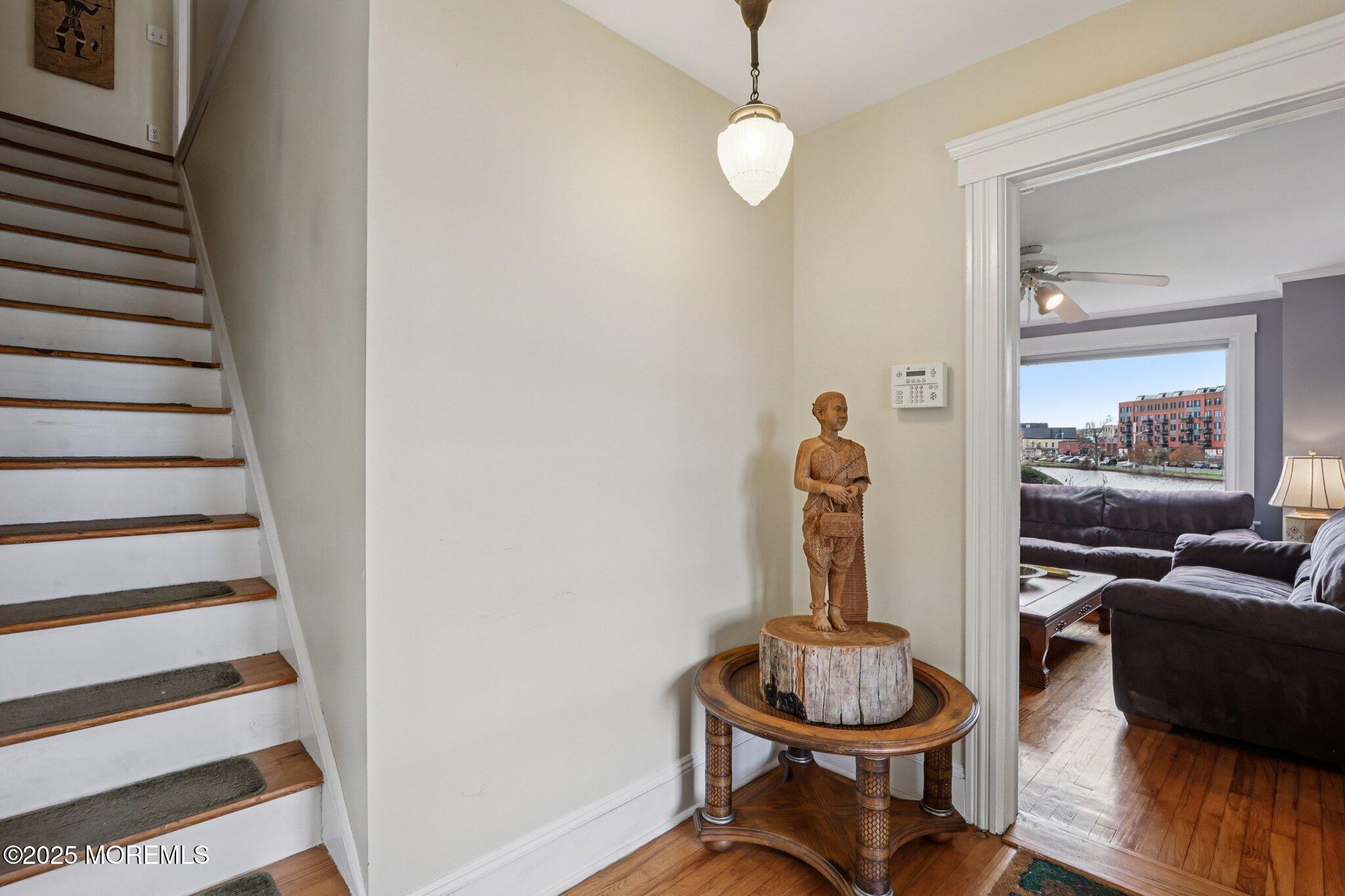 60 Lake Avenue Ocean Grove, NJ 07756 - Photo 22 of 66 a view of a hallway with furniture and wooden floor