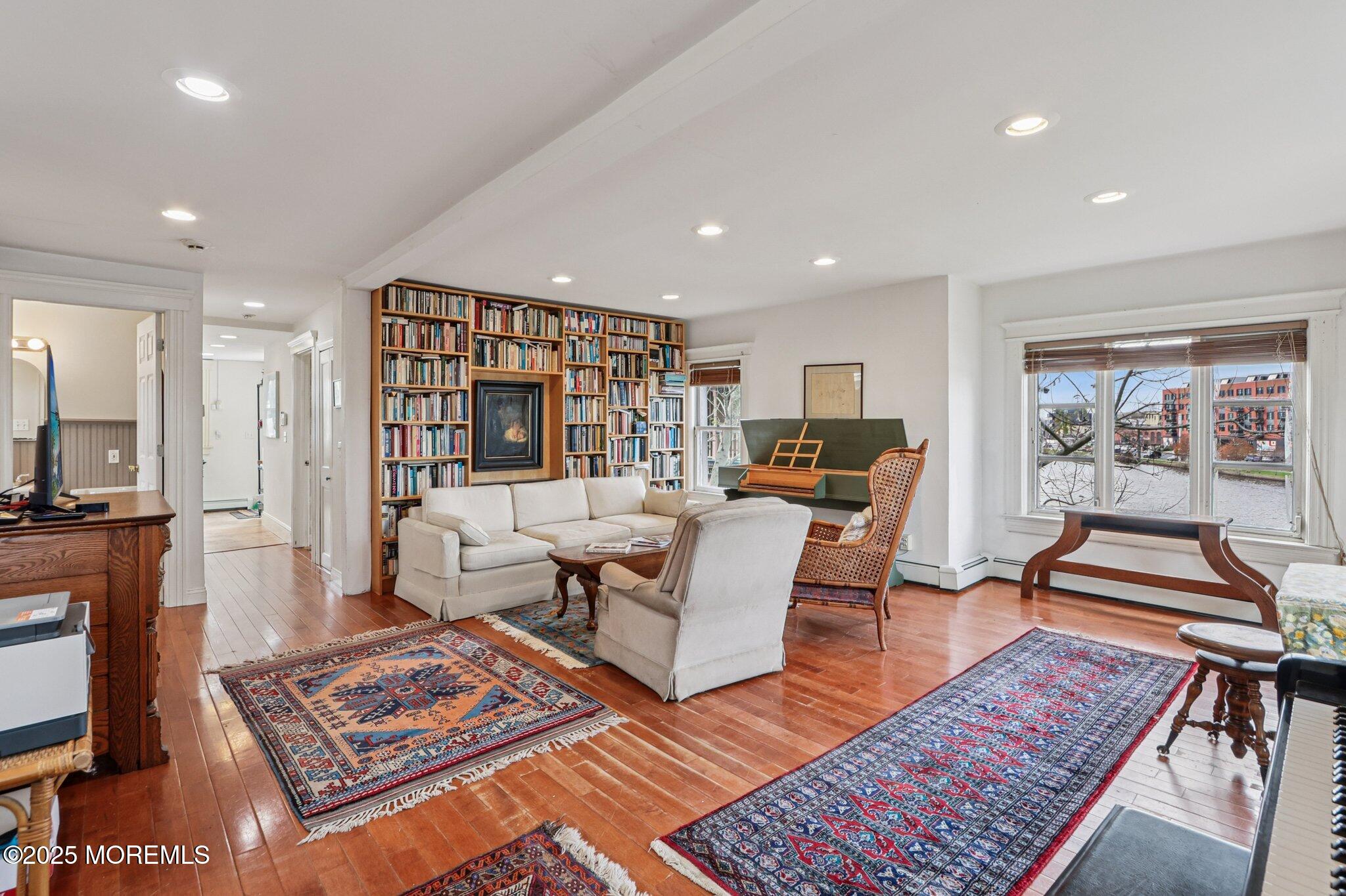 60 Lake Avenue Ocean Grove, NJ 07756 - Photo 26 of 66 a living room with furniture and a table