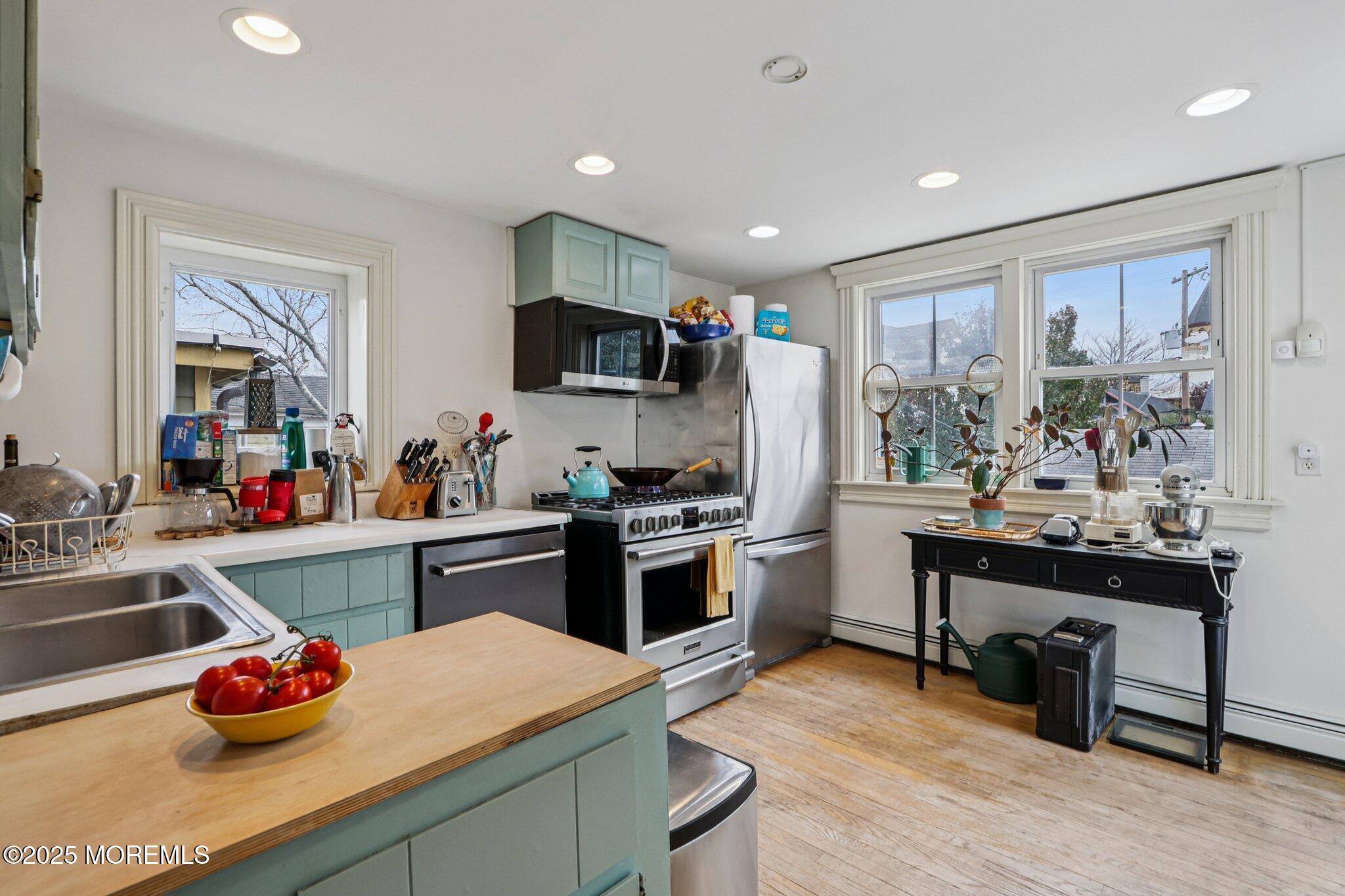 60 Lake Avenue Ocean Grove, NJ 07756 - Photo 28 of 66 a kitchen with a sink stove and microwave